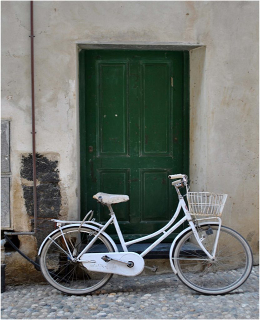 HONORABLE MENTION: White Bike, Photography by Lynne Smyers, 16in x 13in, $175 (February 2019)