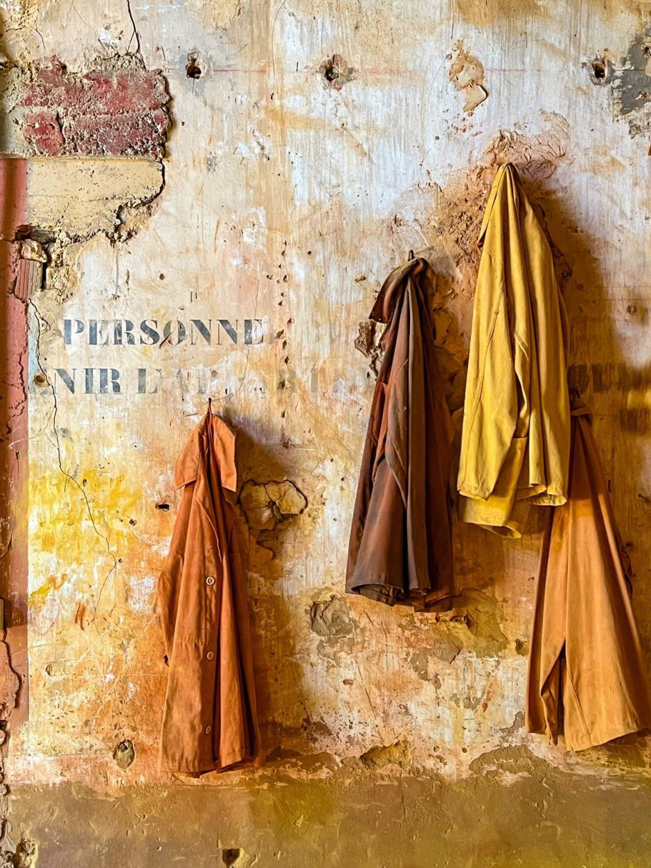 "Coats in Abandoned Ochre Mine" by Penny A. Parrish